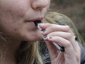 Woman using an electronic cigarette